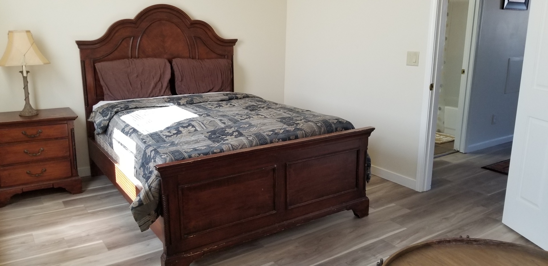 1402 5th Street, Unit 1402 LaSalle, IL 61301 - Photo 10 of 17 a bed sitting in a bedroom next to a wooden floor
