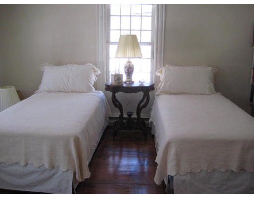 184 Chestnut Plain Road Whately, MA 01093 - Photo 14 of 19 a bedroom with a bed and wooden floor