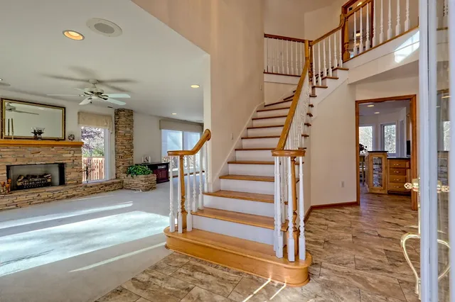 a kitchen with stainless steel appliances granite countertop a sink stove and cabinets