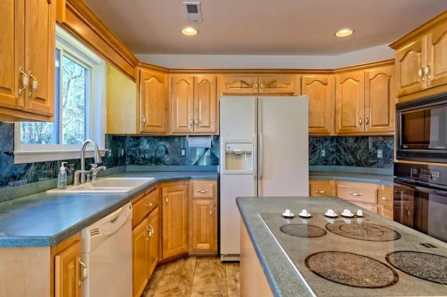 a bathroom with a shower and a glass door