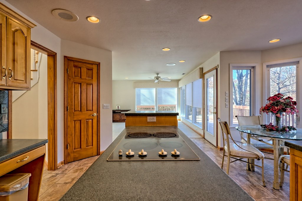 838 Peachtree Hills Road Murphy, NC 28906 - Photo 32 of 92 a kitchen with sink refrigerator and stove