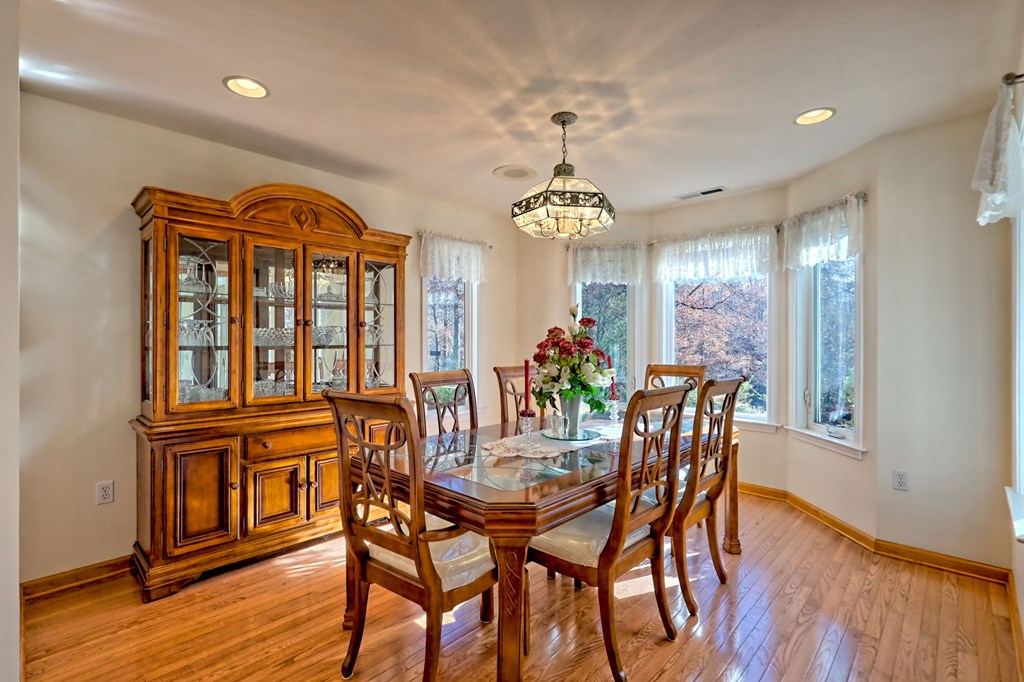 838 Peachtree Hills Road Murphy, NC 28906 - Photo 36 of 92 a view of a dining room with furniture window and wooden floor
