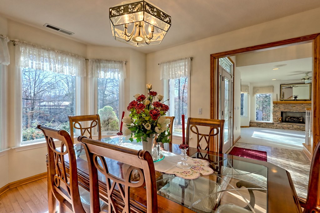 838 Peachtree Hills Road Murphy, NC 28906 - Photo 38 of 92 a view of a dining room with furniture window and wooden floor