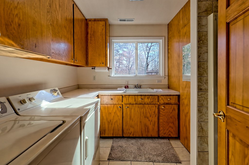 838 Peachtree Hills Road Murphy, NC 28906 - Photo 45 of 92 a utility room with a sink washer and dryer