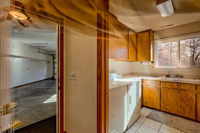 a bathroom with a sink a mirror and a shower