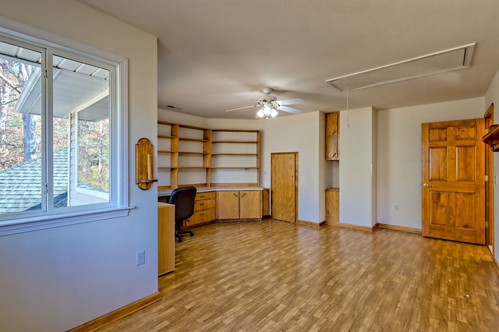 838 Peachtree Hills Road Murphy, NC 28906 - Photo 67 of 92 a view of empty room with a window and wooden floor