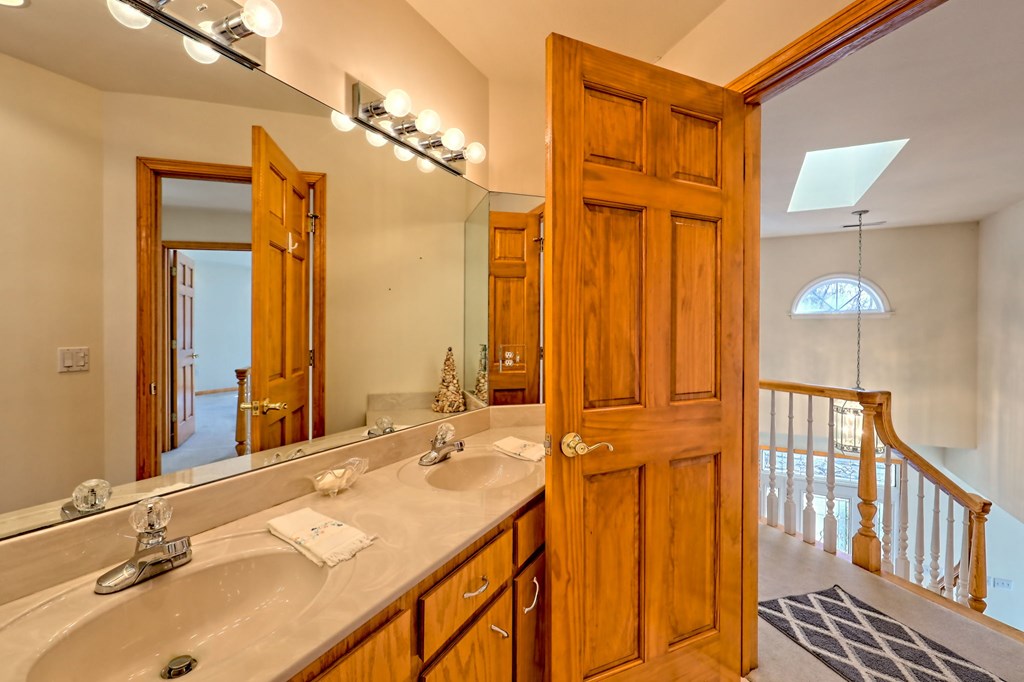 838 Peachtree Hills Road Murphy, NC 28906 - Photo 73 of 92 a bathroom with a double vanity sink and a mirror