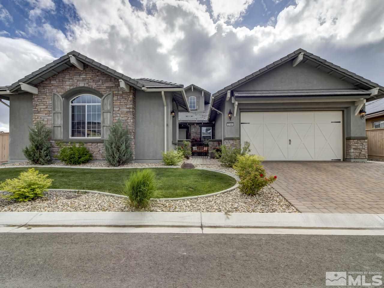 2169 Gazala Lane Reno, NV 89521 - Photo 1 of 25 a front view of a house with a yard and garage