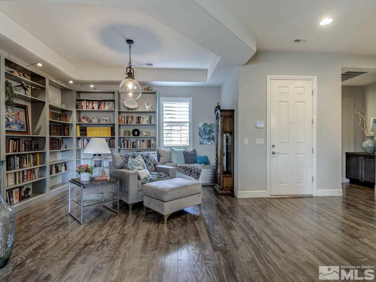 2169 Gazala Lane Reno, NV 89521 - Photo 11 of 25 a living room with furniture and a chandelier
