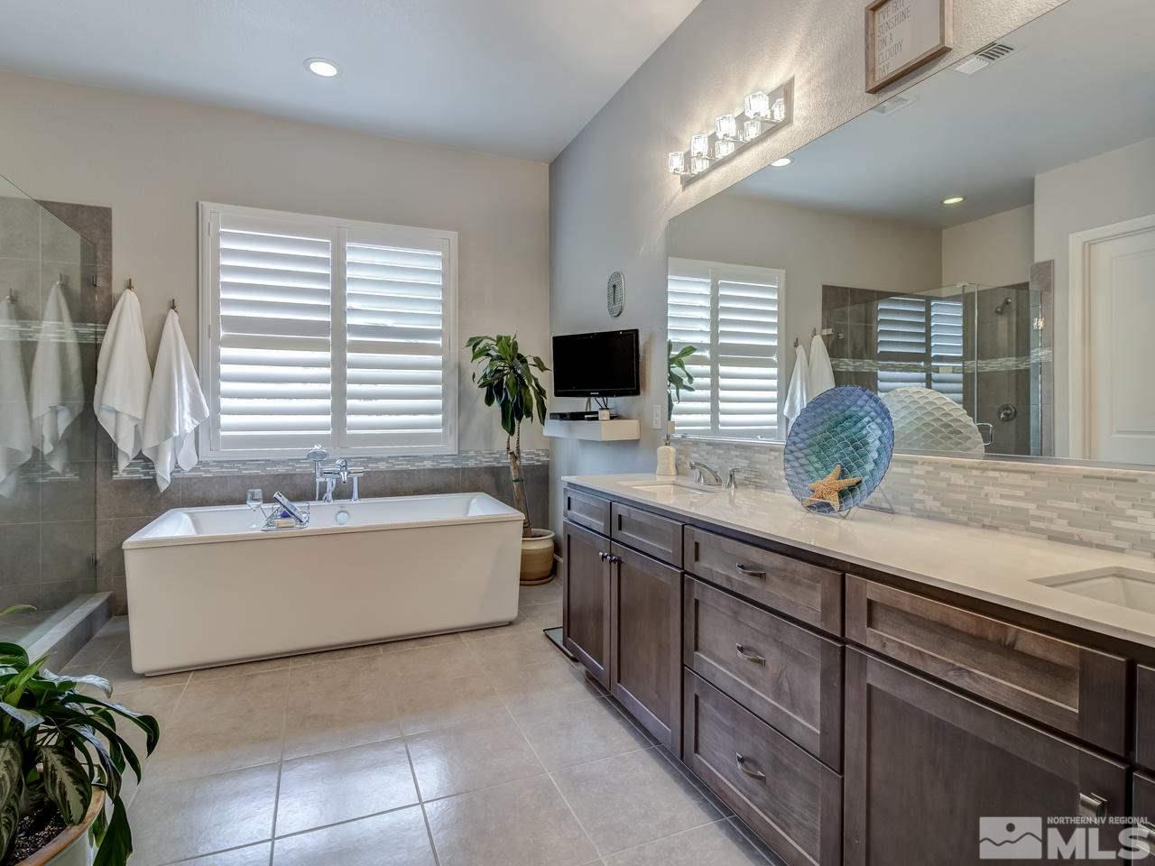 2169 Gazala Lane Reno, NV 89521 - Photo 12 of 25 a bathroom with a tub sink and mirror