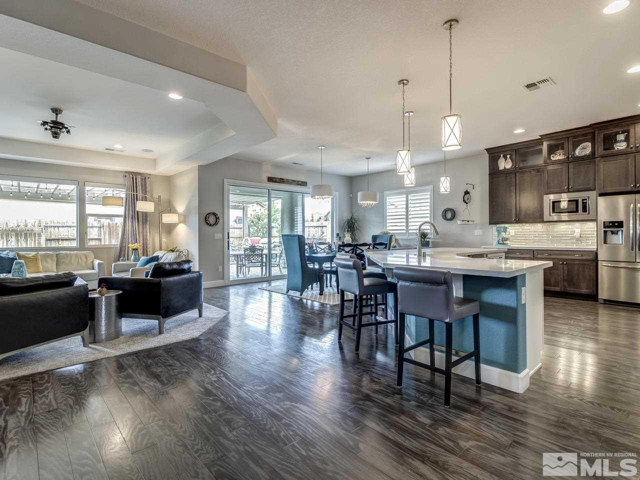 2169 Gazala Lane Reno, NV 89521 - Photo 5 of 25 a kitchen with a dining table chairs and wooden floor