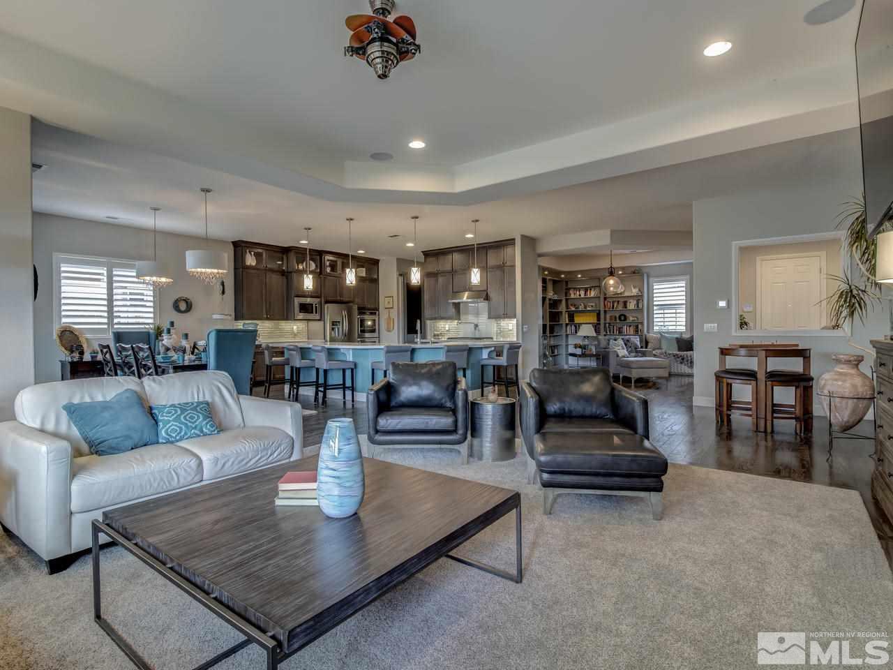 2169 Gazala Lane Reno, NV 89521 - Photo 7 of 25 a living room with fireplace furniture and a view of kitchen