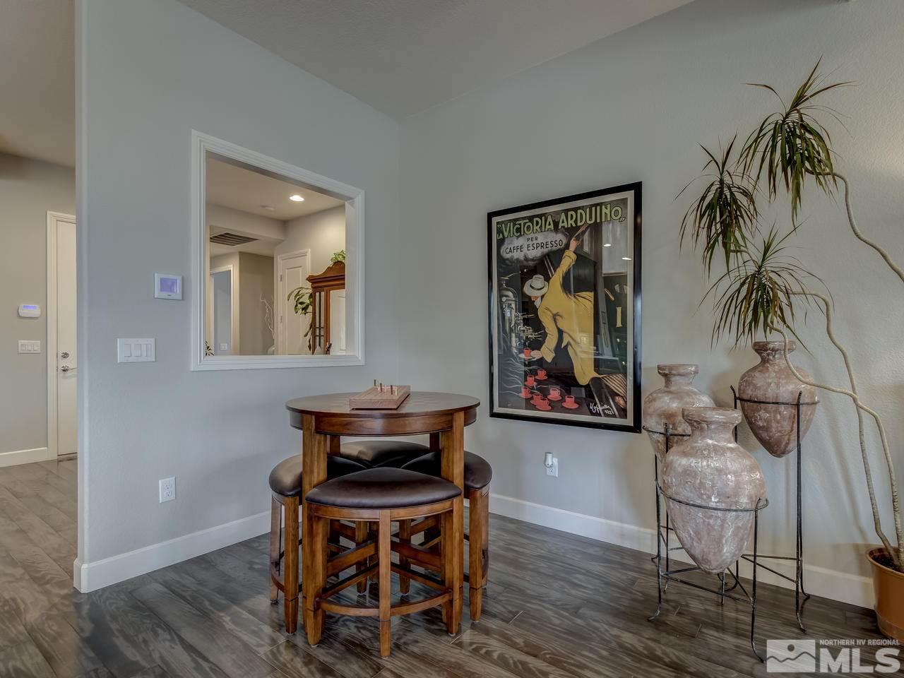 2169 Gazala Lane Reno, NV 89521 - Photo 10 of 25 a view of a dining room with furniture and wooden floor
