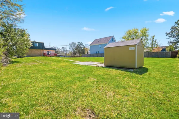 a view of a backyard with table and chairs