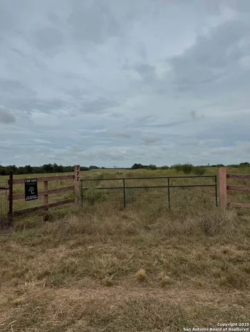 a view of a lake with a yard