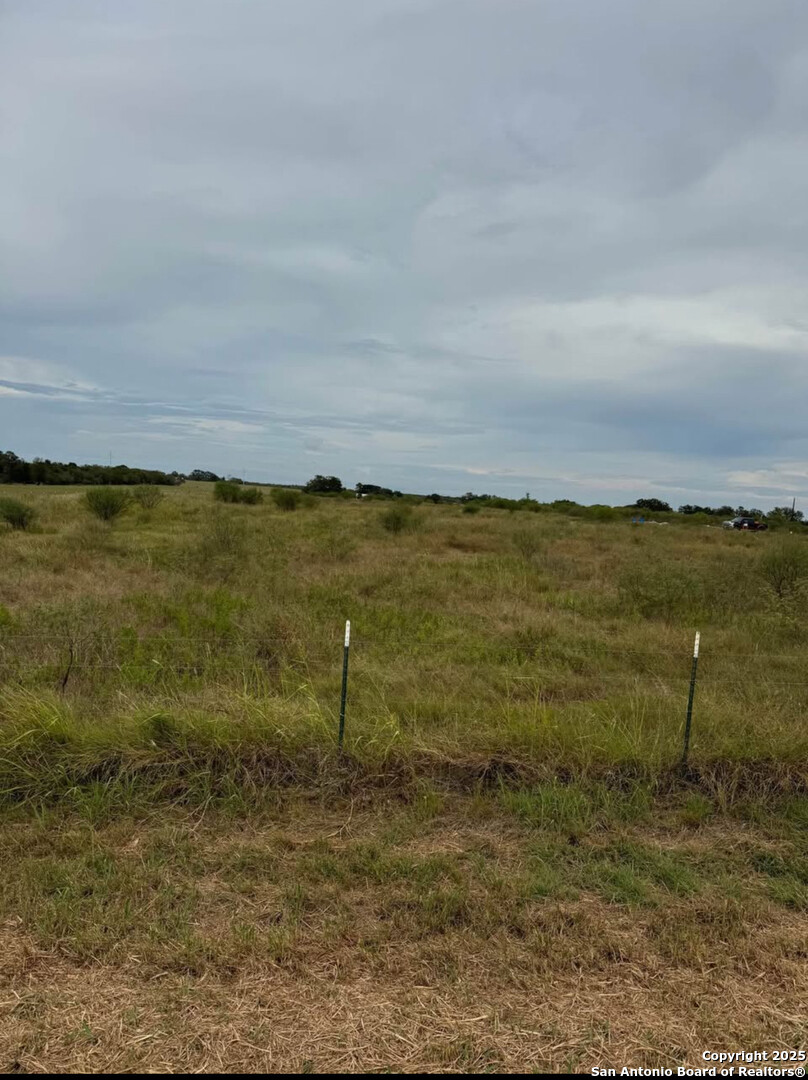 777 Woodrow Center Road Kingsbury, TX 78638 - Photo 2 of 8 a view of a lake with a yard