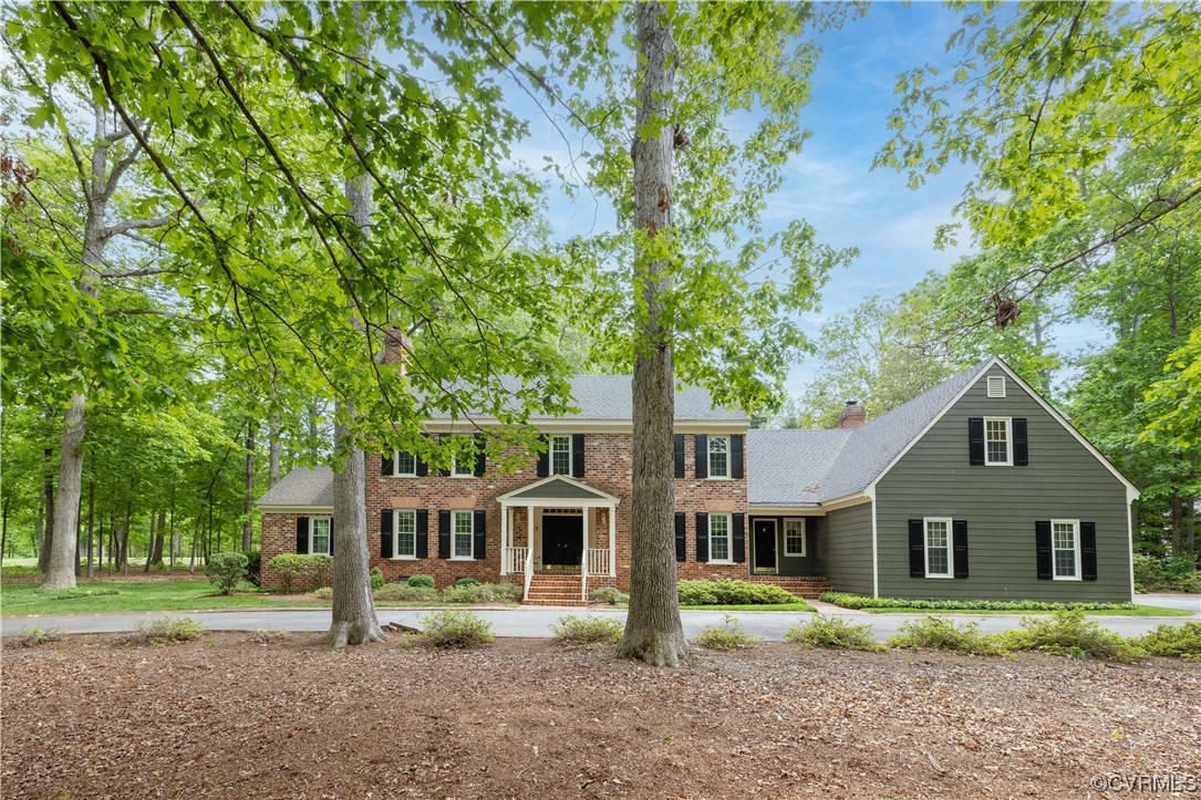 13901 Chepstow Road Midlothian, VA 23113 - Photo 1 of 43 a front view of a house with a garden