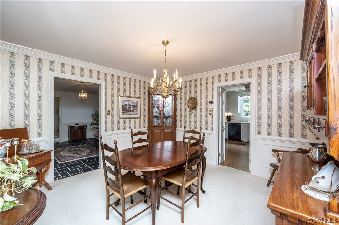 13901 Chepstow Road Midlothian, VA 23113 - Photo 21 of 43 a view of a dining room with furniture and chandelier