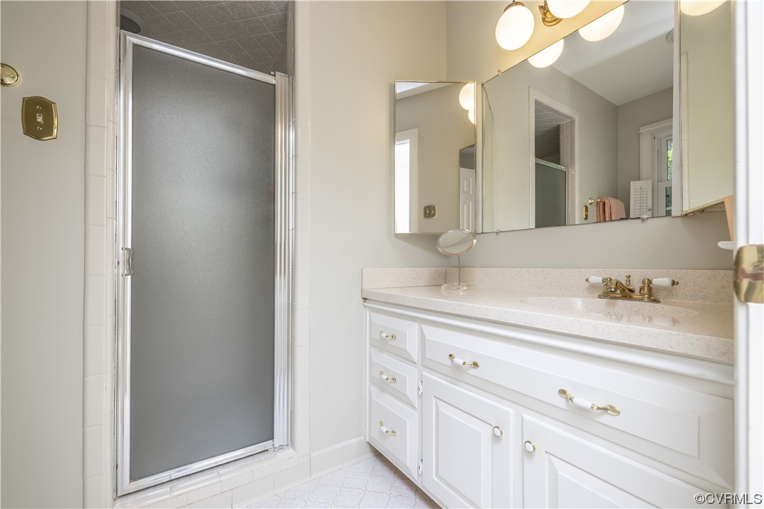 13901 Chepstow Road Midlothian, VA 23113 - Photo 28 of 43 a bathroom with a sink vanity and mirror