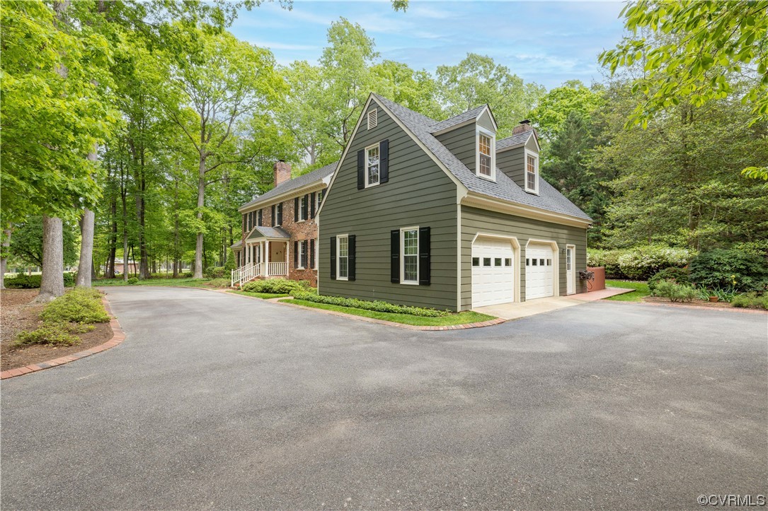 13901 Chepstow Road Midlothian, VA 23113 - Photo 3 of 43 a view of a house with a yard and large trees