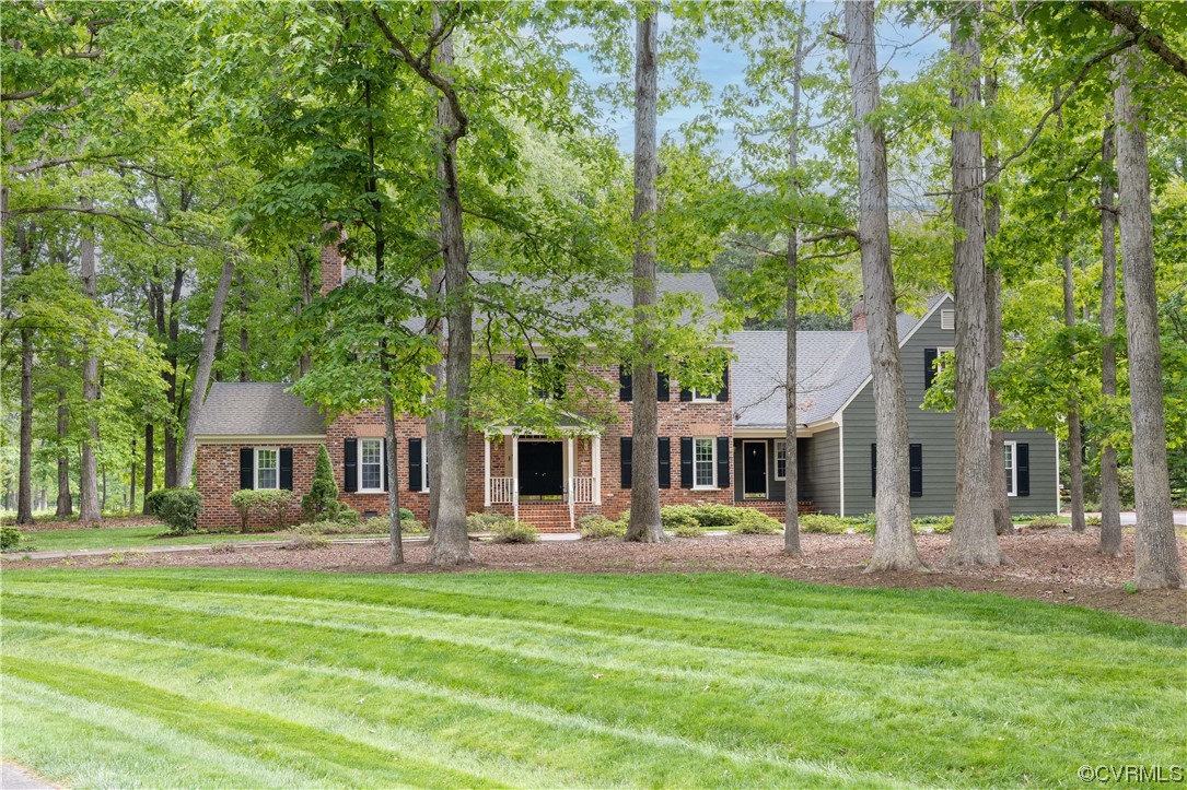 13901 Chepstow Road Midlothian, VA 23113 - Photo 43 of 43 a front view of a residential houses with yard and green space