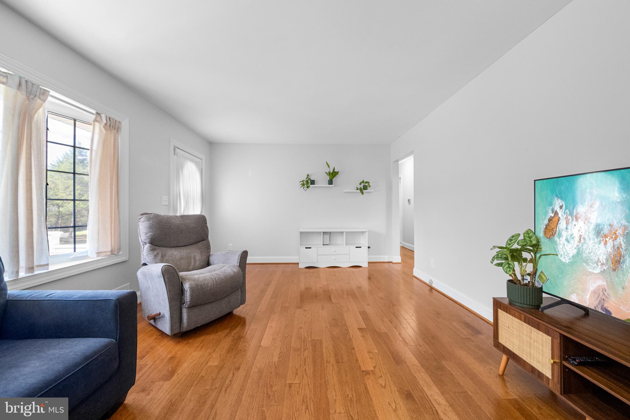 16508 Rolling Tree Road Accokeek, MD 20607 - Photo 16 of 62 a living room with furniture and a flat screen tv