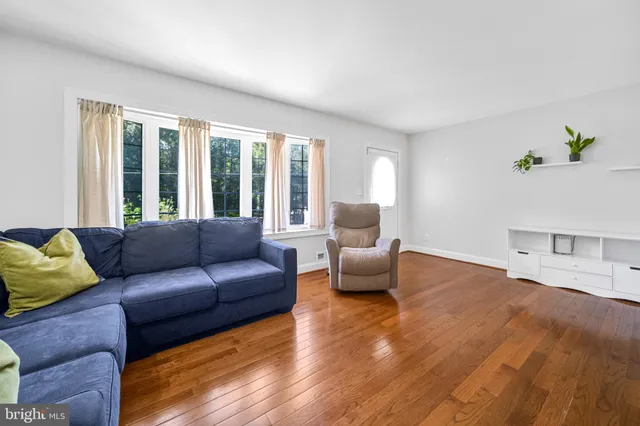 a bedroom with a large bed and a large window