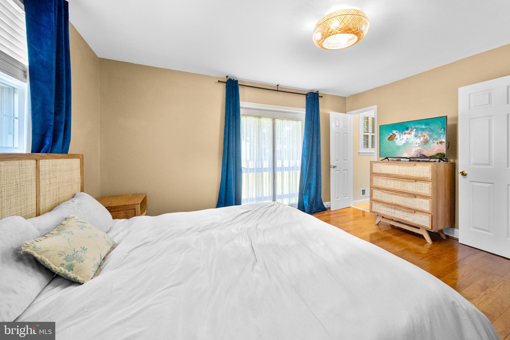 16508 Rolling Tree Road Accokeek, MD 20607 - Photo 22 of 62 a bedroom with a bed and a flat screen tv