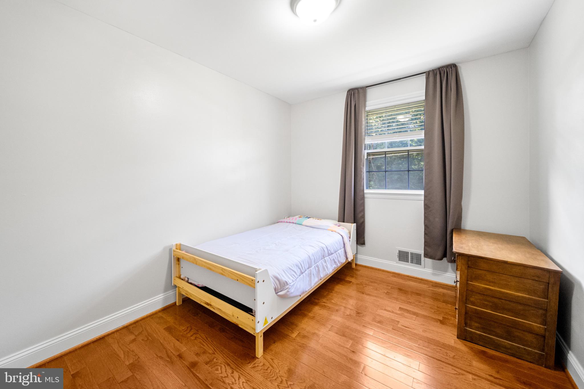 16508 Rolling Tree Road Accokeek, MD 20607 - Photo 27 of 62 a room with a bed and a window