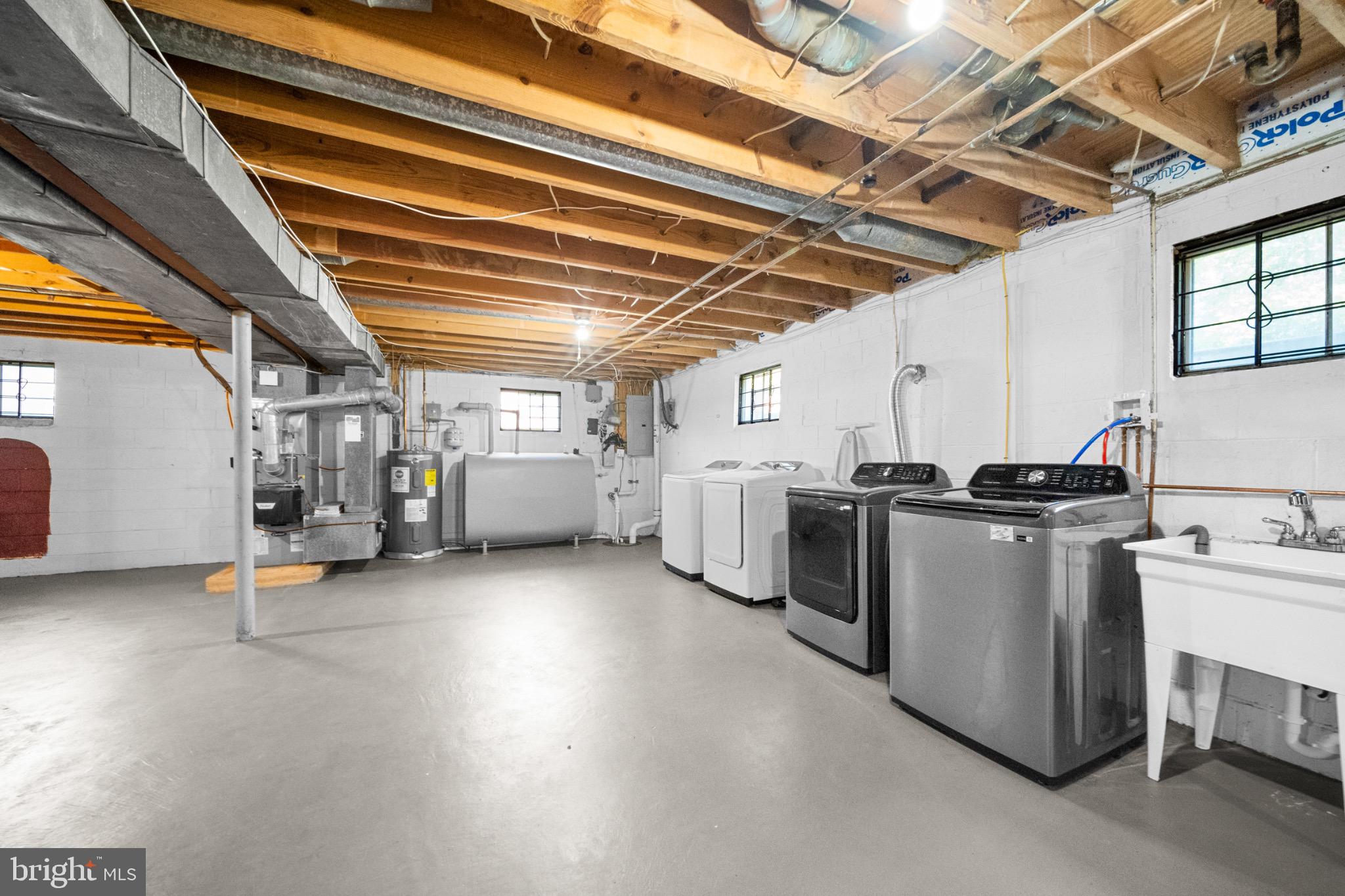 16508 Rolling Tree Road Accokeek, MD 20607 - Photo 32 of 62 a view of a storage & utility room with multiple racks