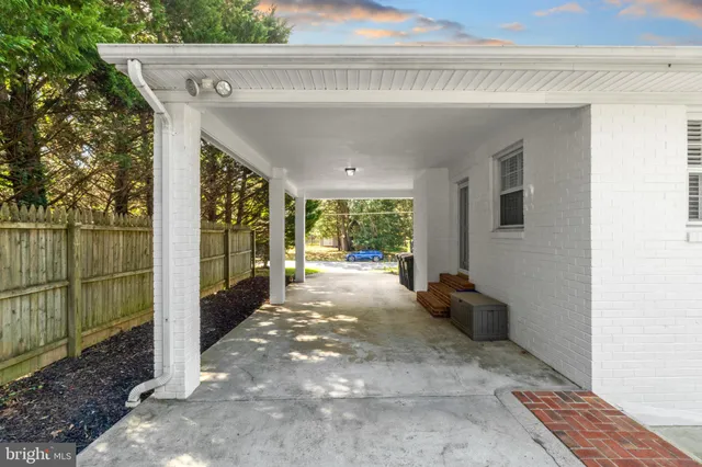 a view of a backyard with sitting area