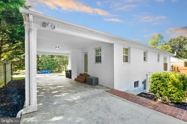 a view of a chairs and table in the garden