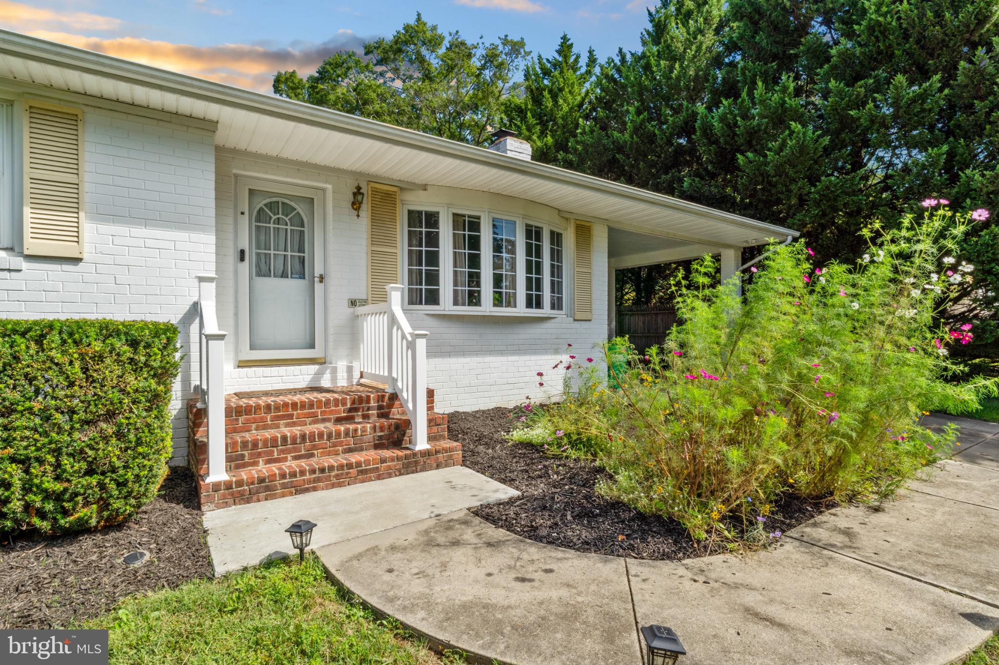 16508 Rolling Tree Road Accokeek, MD 20607 - Photo 4 of 62 Charming entrance with lush greenery.