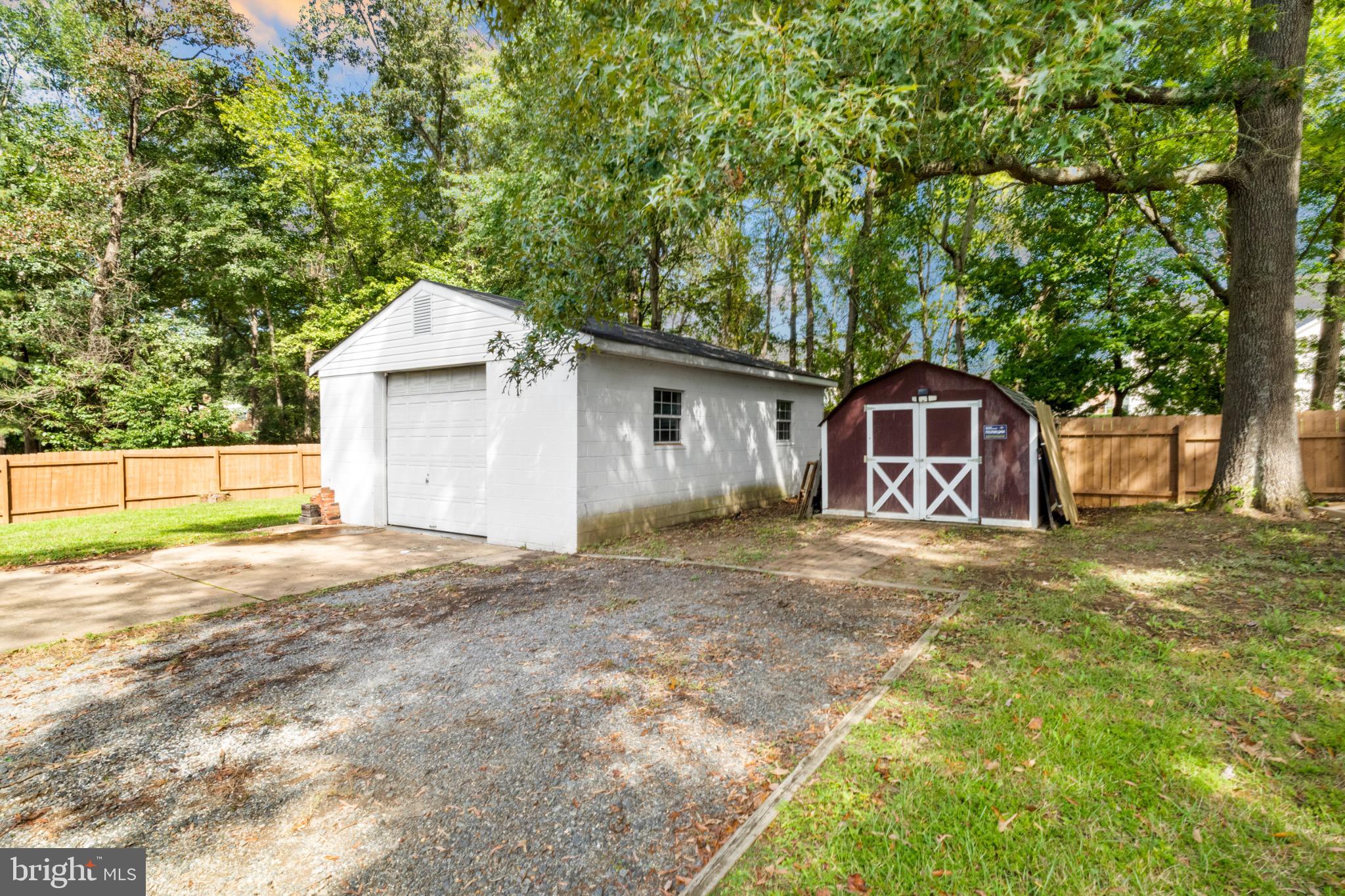 16508 Rolling Tree Road Accokeek, MD 20607 - Photo 47 of 62 a front view of a house with a garden