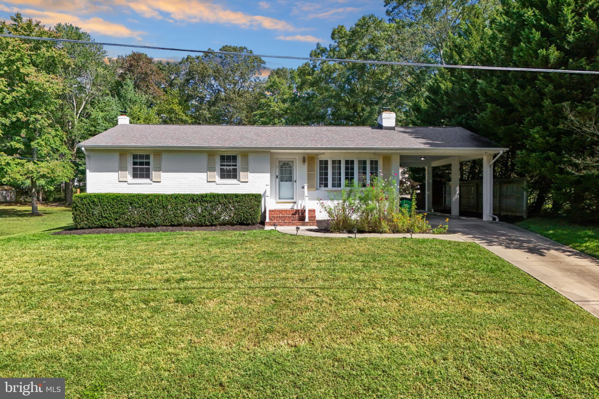 16508 Rolling Tree Road Accokeek, MD 20607 - Photo 54 of 62 a front view of house with yard and green space