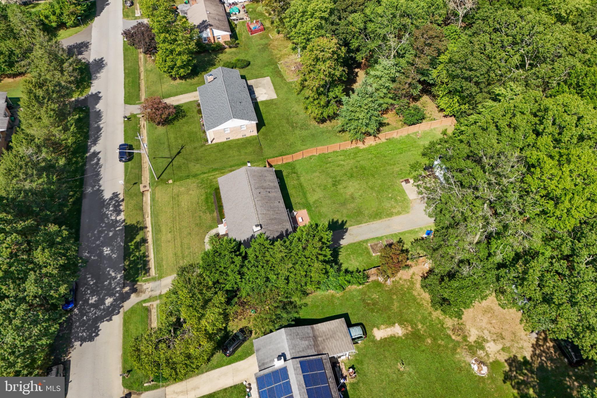 16508 Rolling Tree Road Accokeek, MD 20607 - Photo 56 of 62 an aerial view of a house with a yard and trees