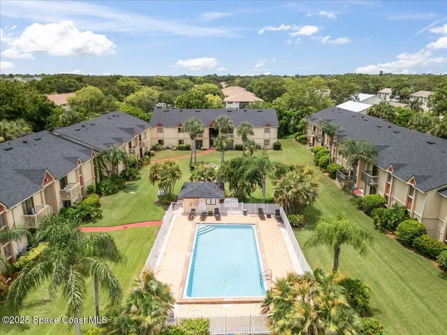 an aerial view of a house with a garden