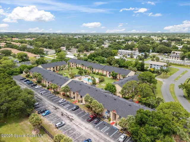 an aerial view of a house with a garden