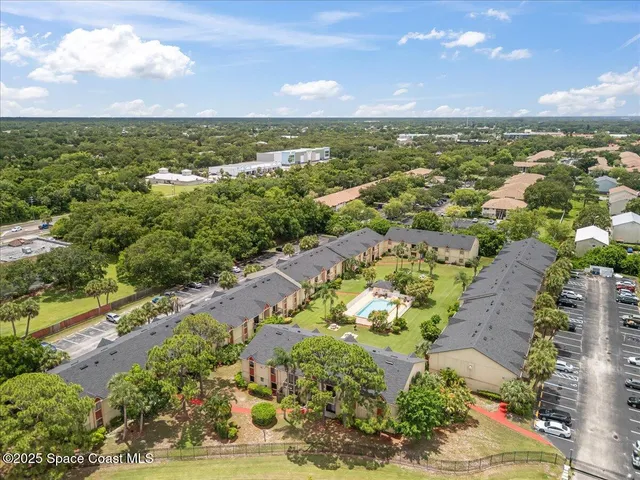 an aerial view of a house with a garden
