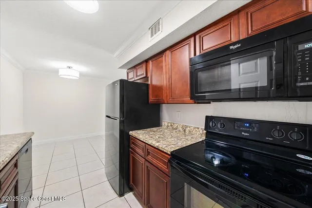 a kitchen with a stove microwave and refrigerator