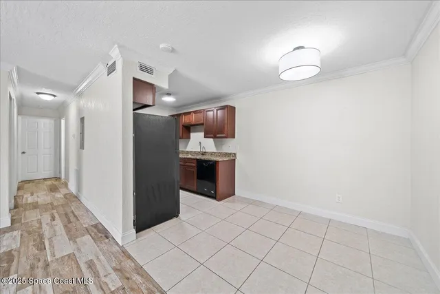 a view of kitchen with cabinets