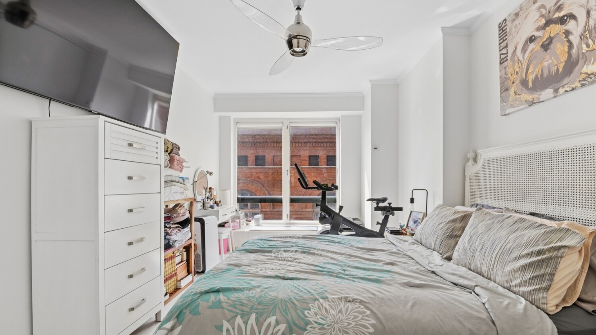 530 East 76th Street, Unit 6J Manhattan, NY 10021 - Photo 11 of 12 a bed room with a bed and a mirror