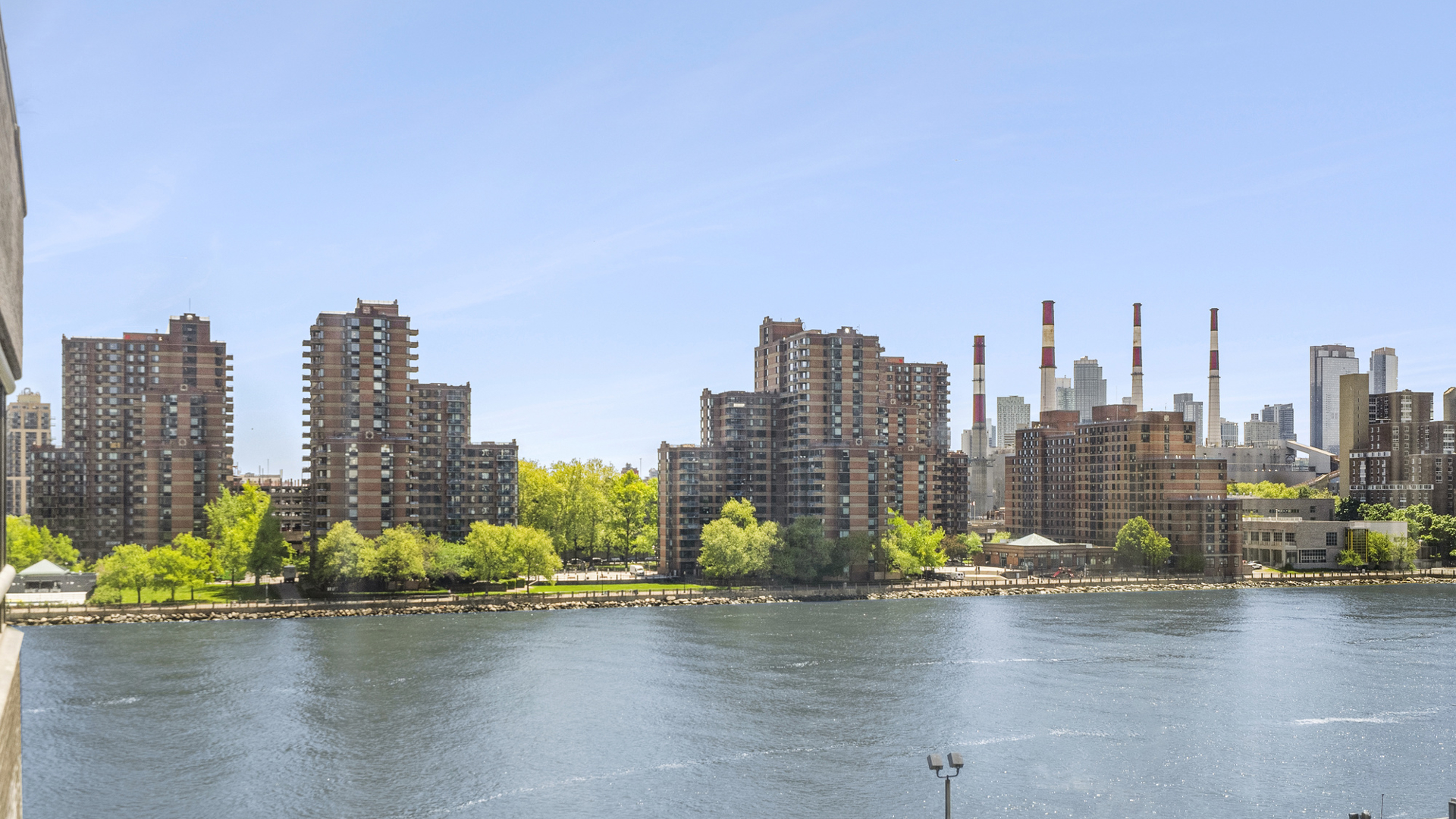 530 East 76th Street, Unit 6J Manhattan, NY 10021 - Photo 12 of 12 a view of a city with tall buildings