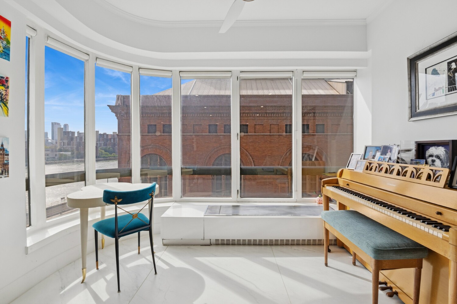 530 East 76th Street, Unit 6J Manhattan, NY 10021 - Photo 3 of 10 a living room with a large window and a table
