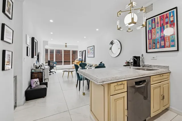 a living room with a large window and a table