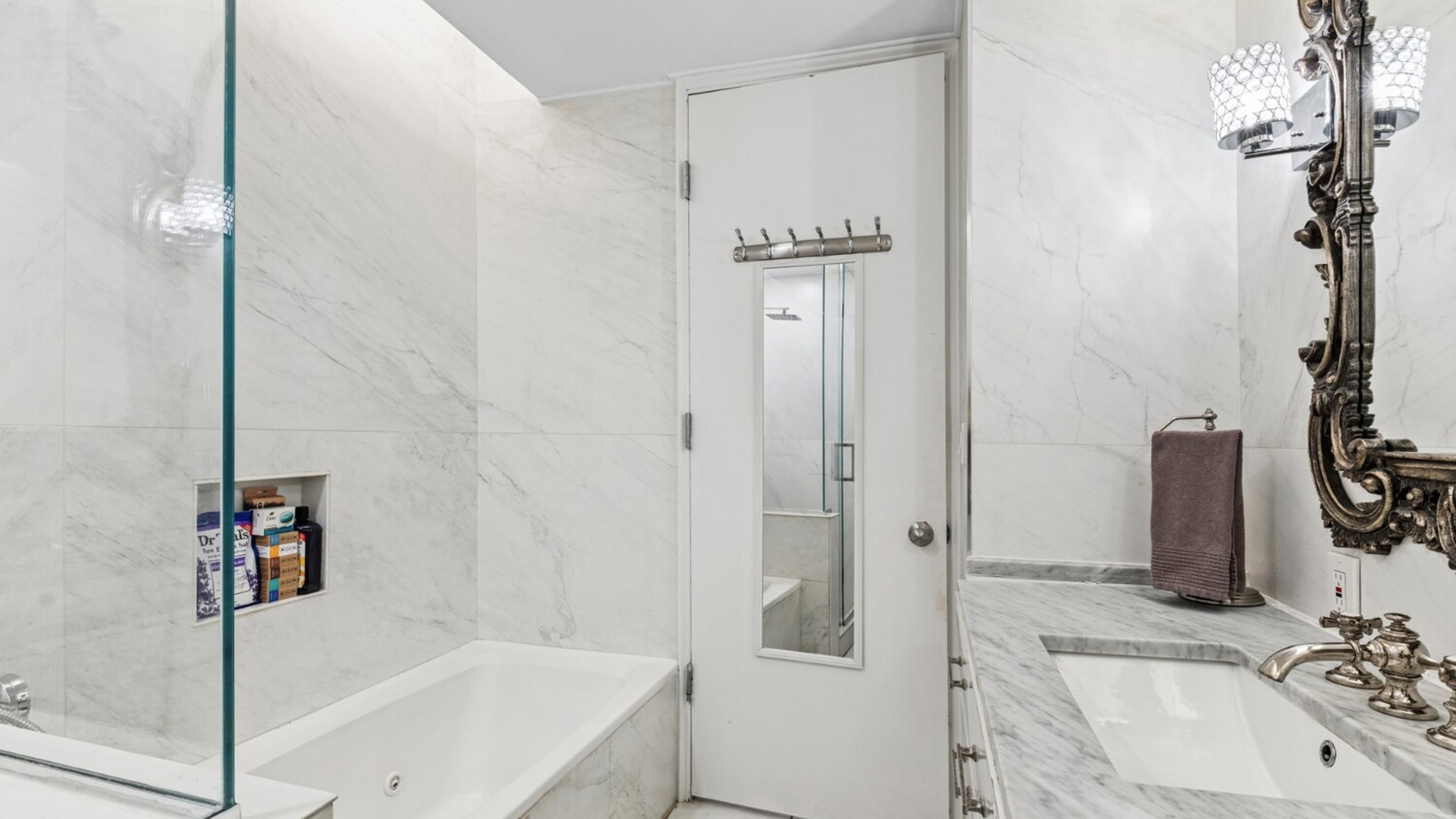 530 East 76th Street, Unit 6J Manhattan, NY 10021 - Photo 6 of 12 a bathroom with a sink a toilet and shower