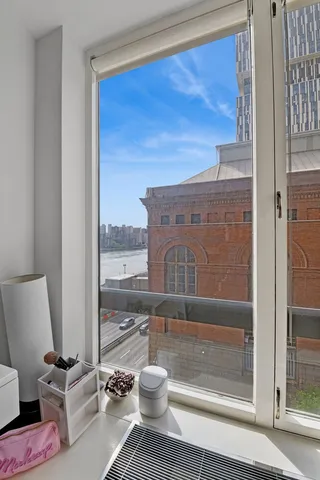 a bed room with a bed and a television