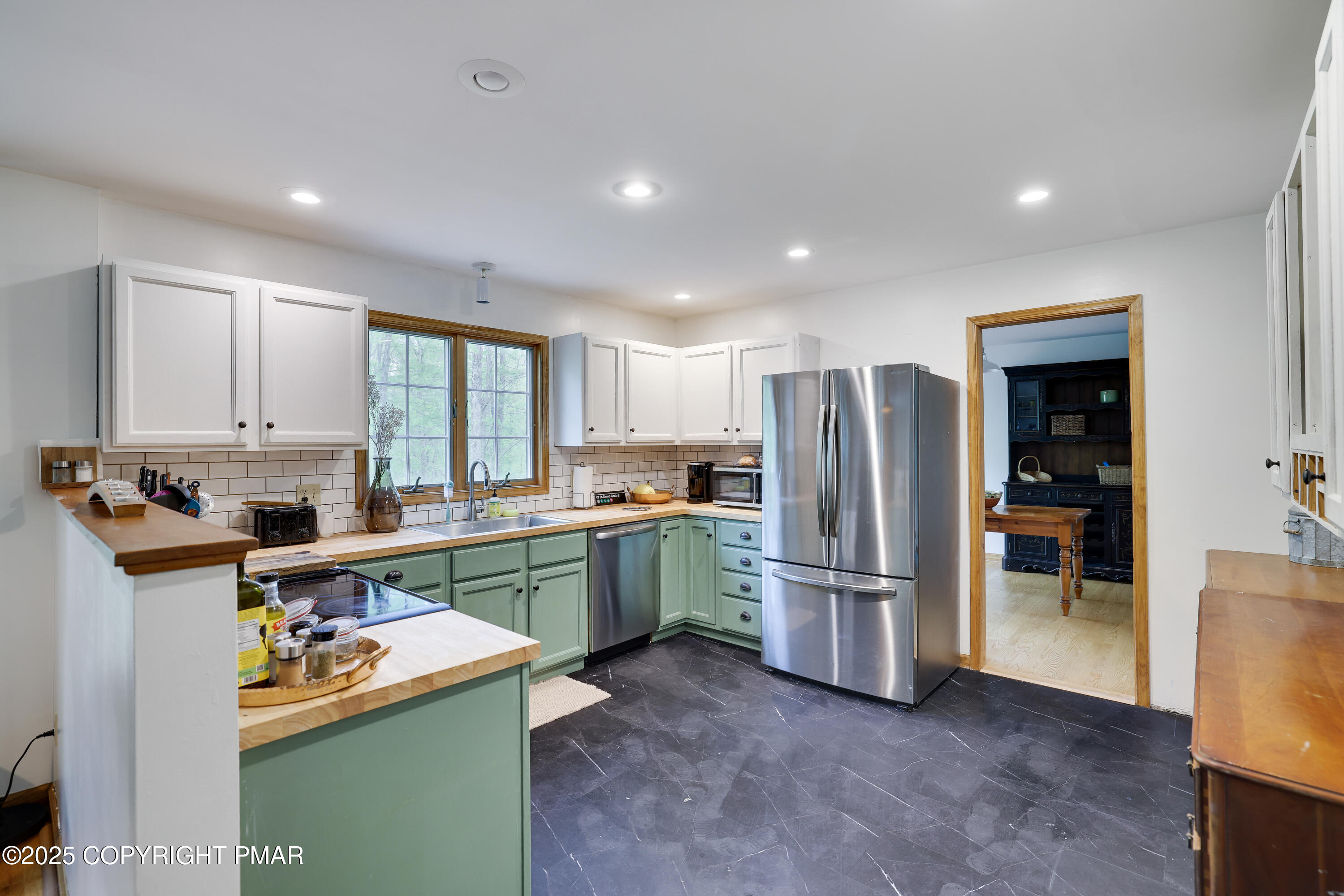 113 Hemlock Road Tannersville, PA 18372 - Photo 11 of 68 a kitchen with refrigerator and cabinets