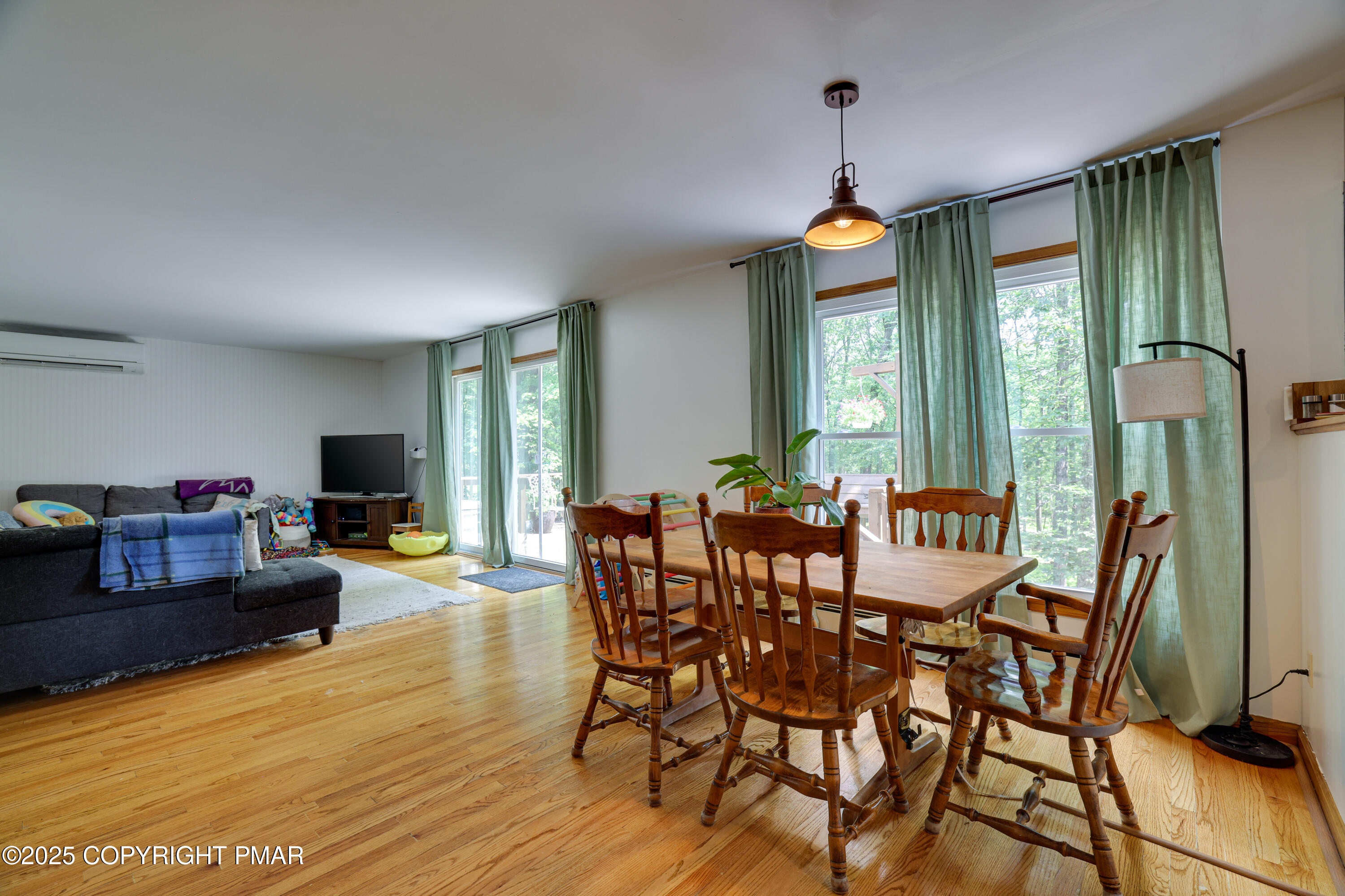 113 Hemlock Road Tannersville, PA 18372 - Photo 18 of 68 a view of a dining room with furniture window and wooden floor