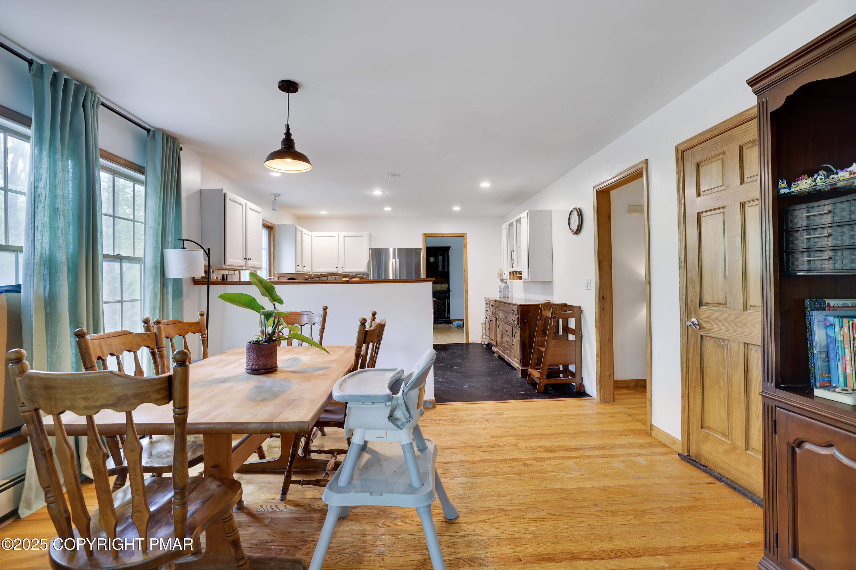 113 Hemlock Road Tannersville, PA 18372 - Photo 19 of 68 a large kitchen with dining room and wooden floor